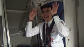 The plane's two cabin crew members had fun with the unusual situation and hammed it up for the camera