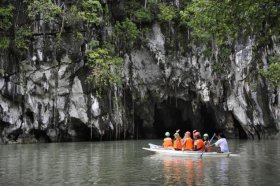 Tourists prepare to enter the Puerto Princesa Subterranean River National Park located in Puerto Princesa on the western Philippine island of Palawan. The natural formation features a limestone karst mountain landscape surrounded by thick forest with an 8.2 kilometer navigable underground river that flows directly into the South China Sea. It includes major formations of stalactites and stalagmites, and several large chambers.